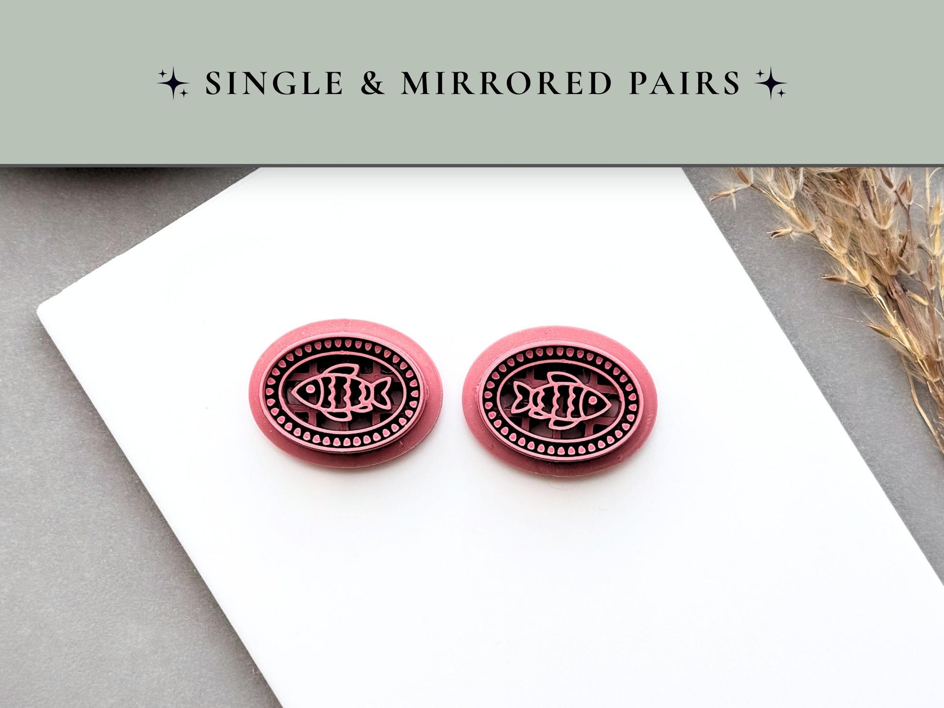 Mirrored fish polymer clay cutter pair displayed side by side, featuring left and right facing fish designs within decorative beaded oval frames for creating matching earrings, coastal jewellery and ocean-inspired craft projects.