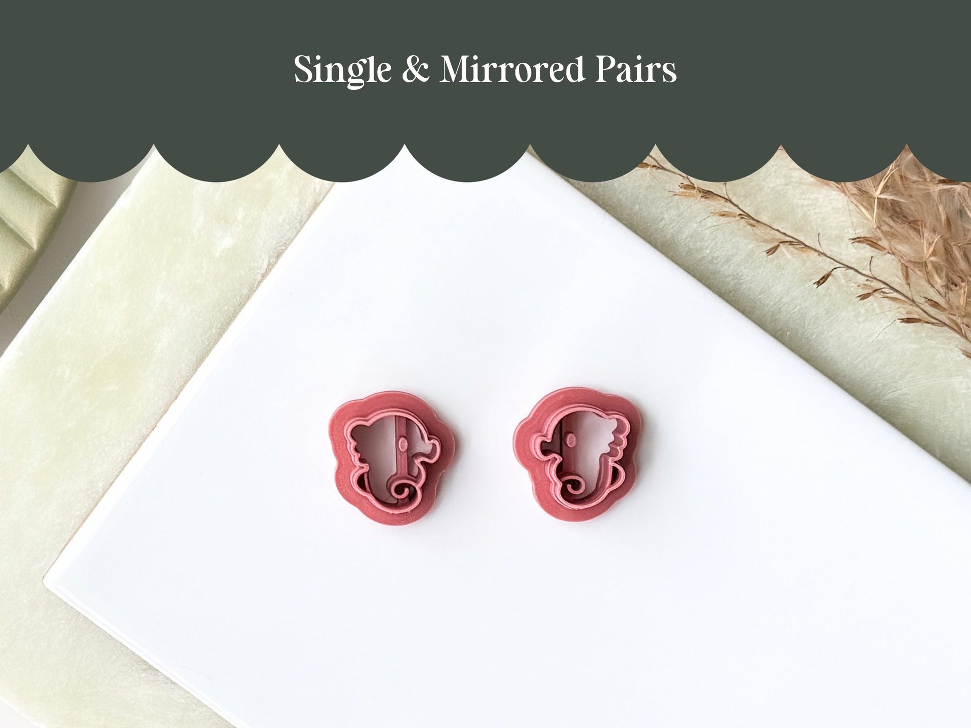 A pair of mirrored seahorse clay cutters for making polymer clay earrings or fondant decorations.