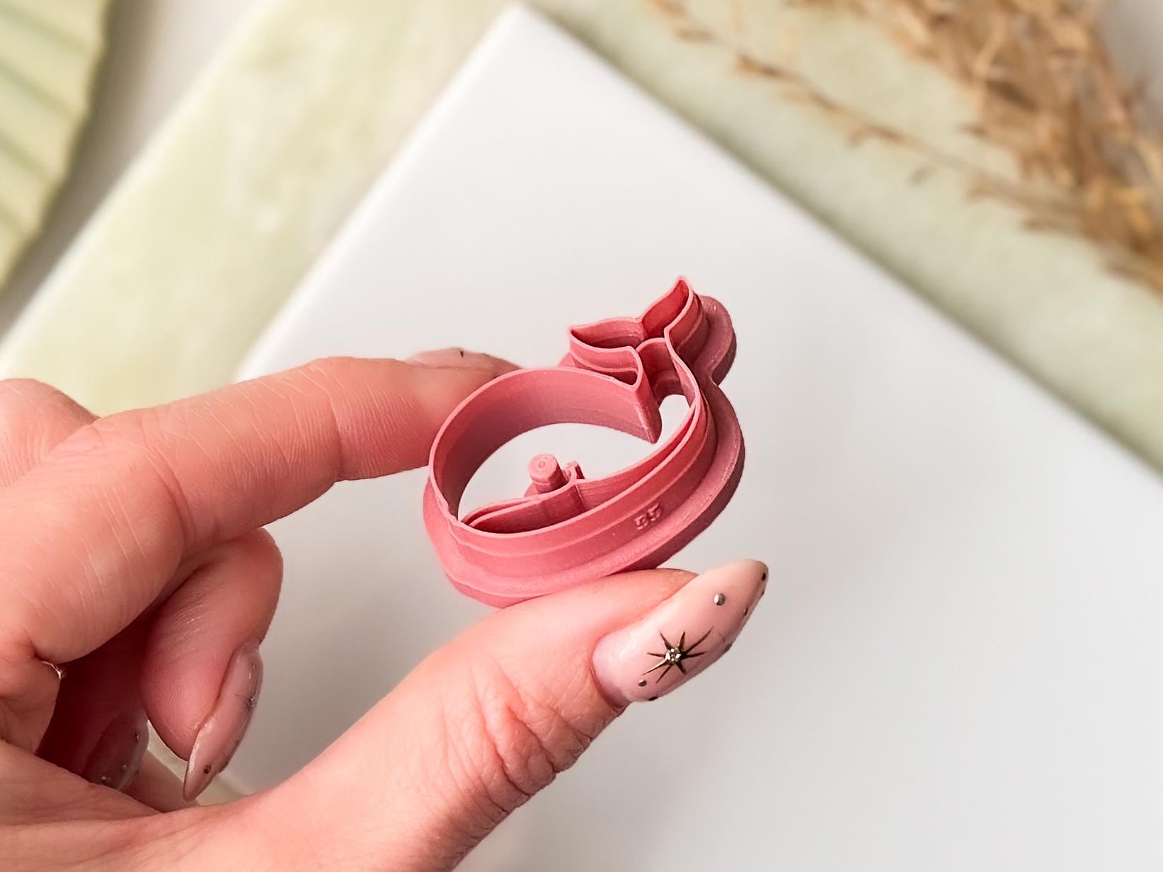 Close-up of whale clay cutter showing smiling face stamp detail — handmade in the UK by Fabled Cutters